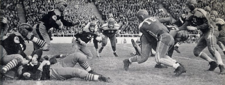 1939 Lubbock State Champion Football Team players swarming a ball carrier in a black-and-white game action photo