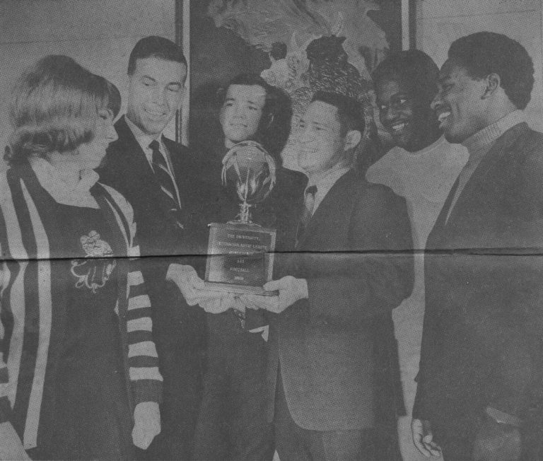 1968 Estacado Matadors Football coach Jimmie Keeling, co-captains and school leaders with the Class AAA state trophy