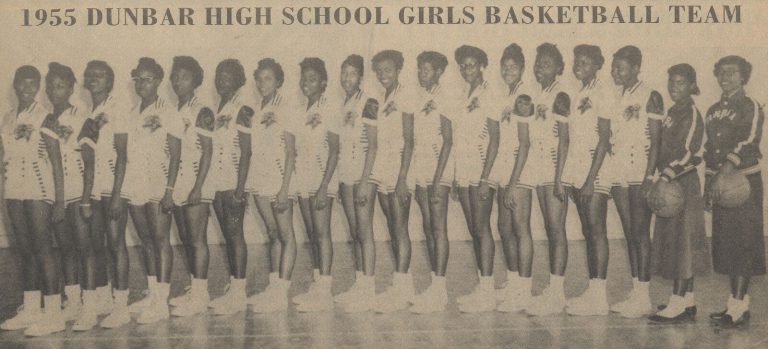 Celestine H. Kyle's 1955 Dunbar High School girls basketball team lined up in profile, from a Black History Month banner