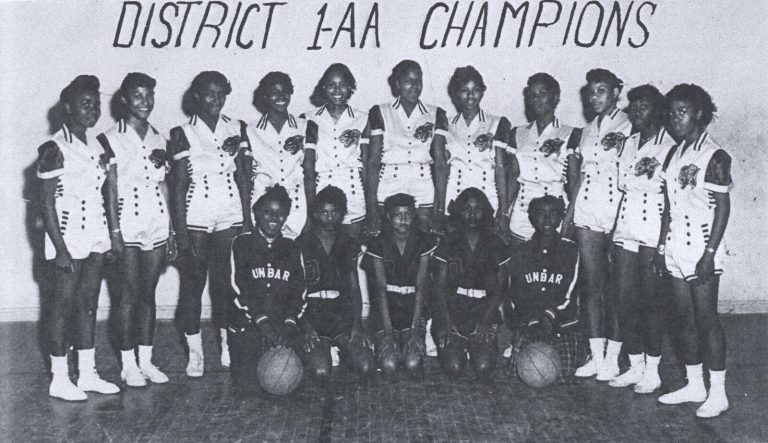 Celestine H. Kyle's Dunbar girls basketball team posed under District 1-AA Champions lettering, from a yearbook