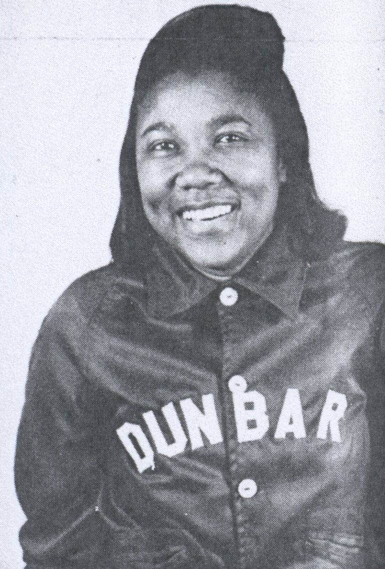 Celestine H. Kyle smiling in a Dunbar jacket, black-and-white portrait