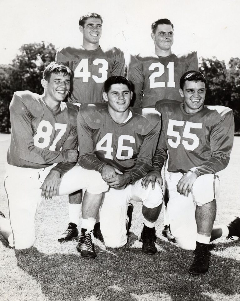 Charles Brewer, No. 21, posed with four Texas teammates wearing numbers 43, 87, 46 and 55