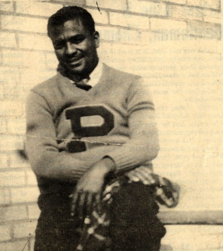 Damon Hill, Sr. in a Prairie View A&M College sweater on the Dunbar High School campus in 1946, from a newspaper