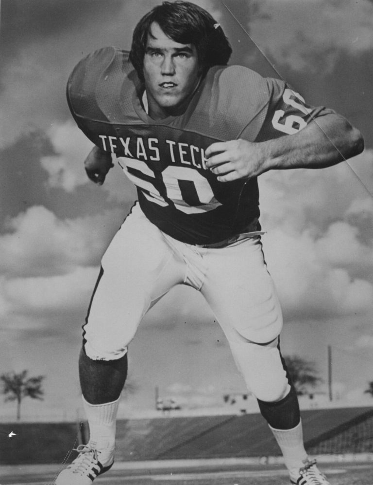 Dan Irons in a ready stance wearing Texas Tech No. 60, black-and-white action pose