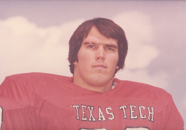Dan Irons in a red Texas Tech football jersey, color portrait