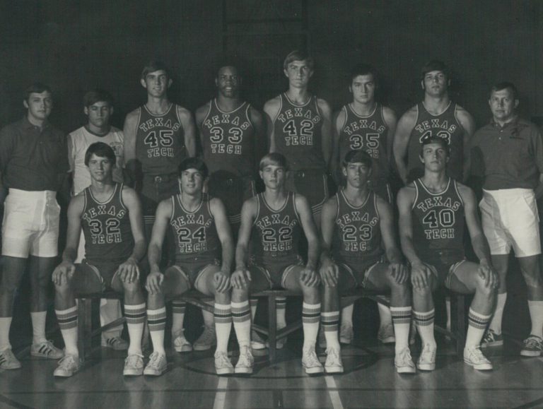 David Thetford with Texas Tech basketball teammates and coaches in a posed black-and-white team photo