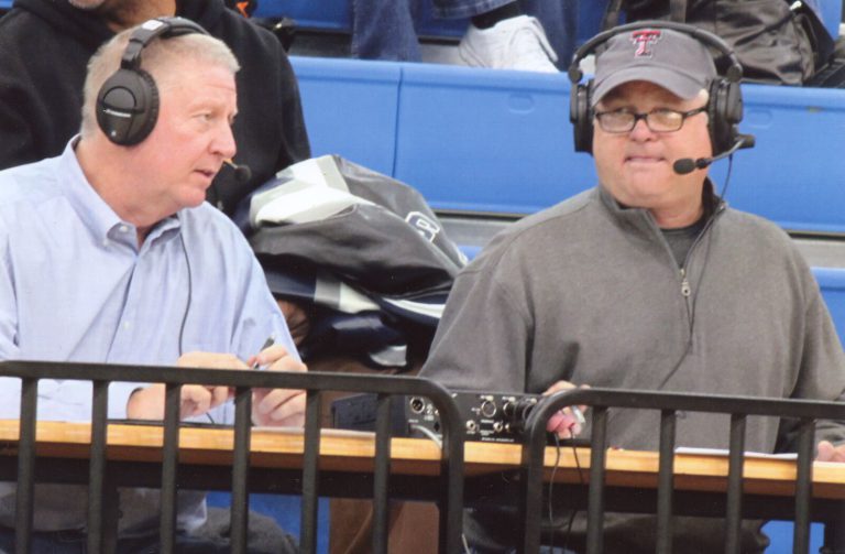 David Thetford's radio career: two men in headsets sharing a courtside broadcast table