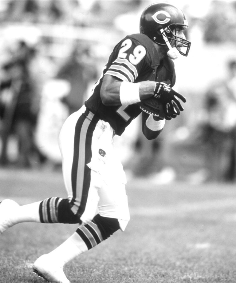 Dennis Gentry, No. 29 for the Chicago Bears, running with the football in a black-and-white press photo
