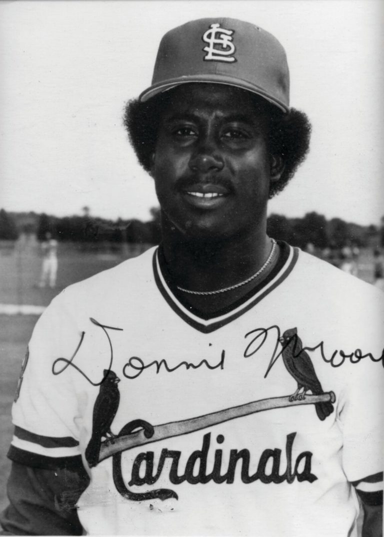 Donnie Moore in a St. Louis Cardinals cap and jersey in a black-and-white portrait with an autograph