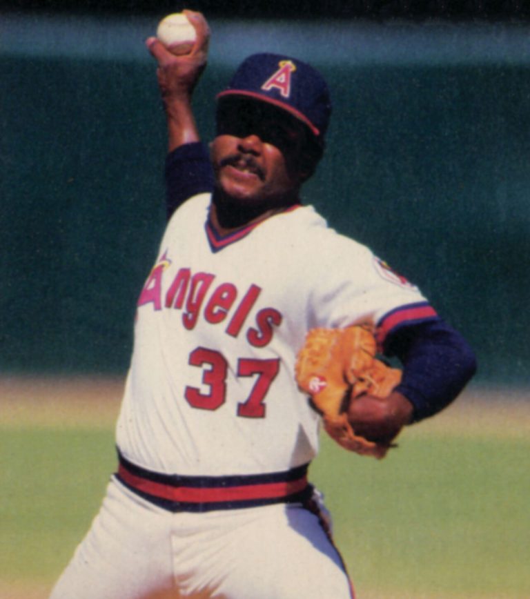 Donnie Moore in a white No. 37 Angels uniform winding up to pitch with the ball raised