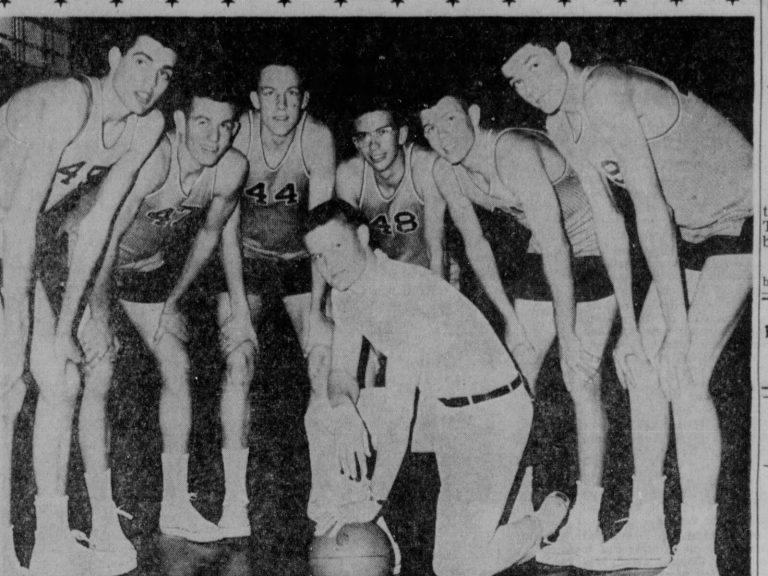 Gerald Myers kneeling with a basketball as six Monterey seniors bend in close, from a 1962 newspaper clipping