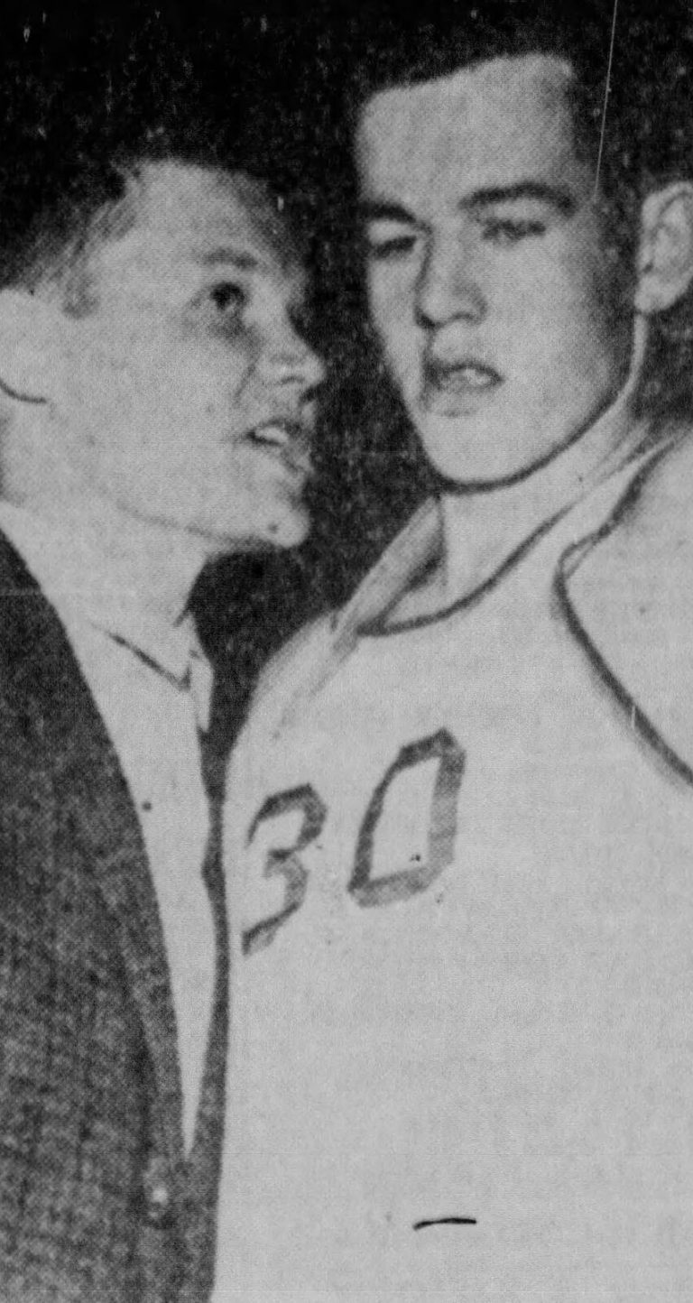 Gerald Myers in a tweed jacket giving last-second instructions to a Monterey player, from a 1962 newspaper clipping