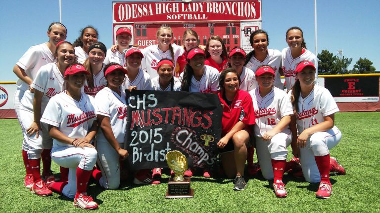 J. J. Johnson's Coronado Mustangs softball team with a 2015 Bi-District Champs banner and gold glove trophy