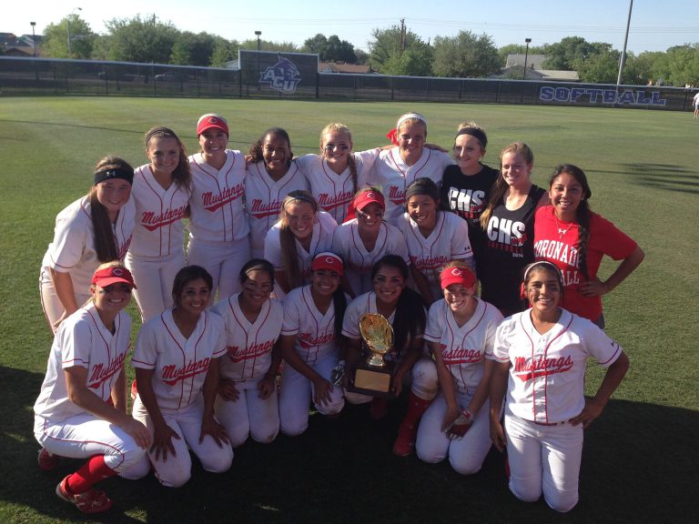 J. J. Johnson's Coronado Mustangs softball team posing with a gold glove trophy on the field