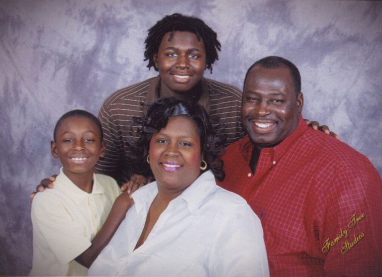 James Collins with family in a studio portrait