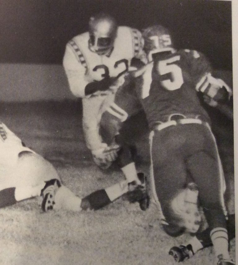 James Mosley, number 32, heading for a hole in the Sweetwater defense during a 1968 game, black-and-white photo