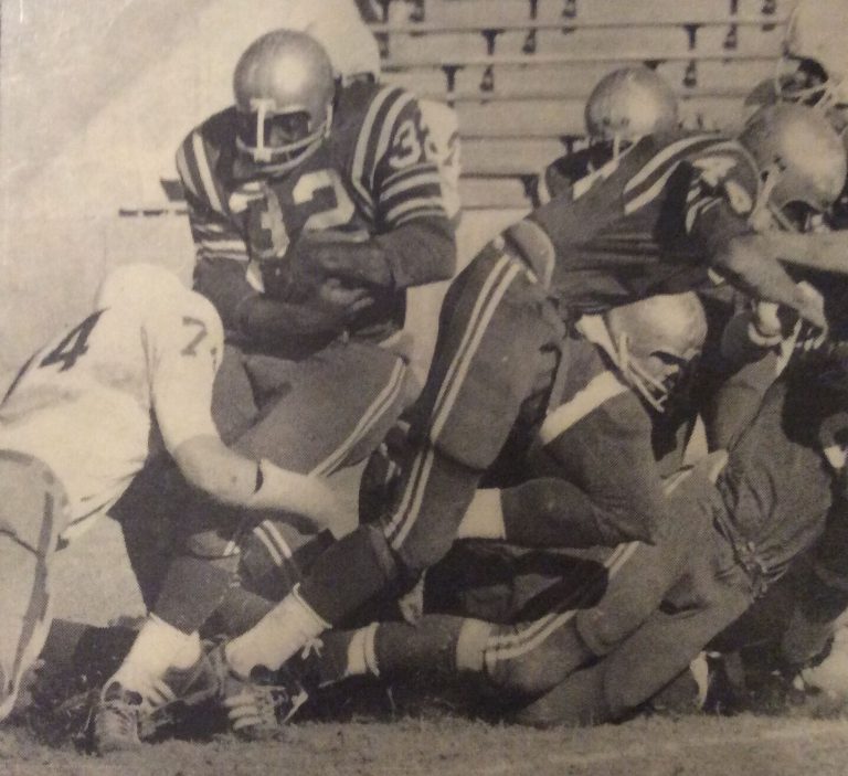 James Mosley, number 32, following a block from Larry Miller in a December 1968 game, from a newspaper clipping