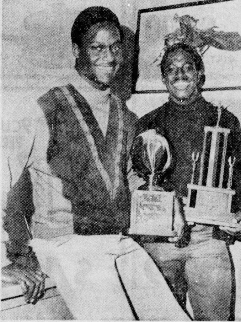 James Mosley and co-captain Fred White smiling with district and bi-district trophies, from a 1968 newspaper clipping