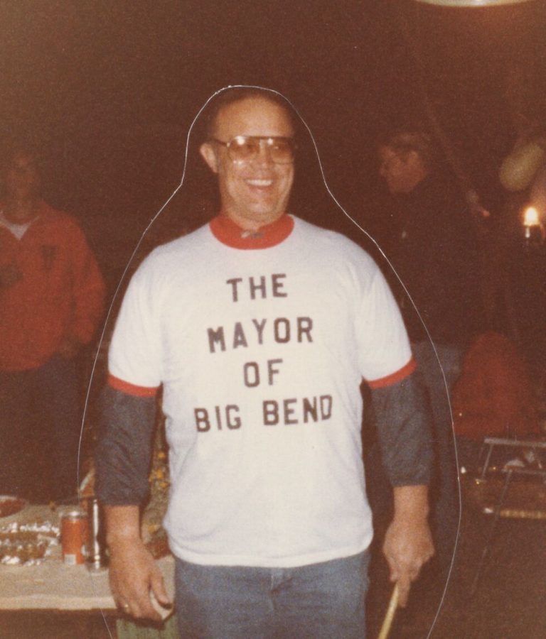 James Odom smiling in a ringer t-shirt that reads The Mayor of Big Bend