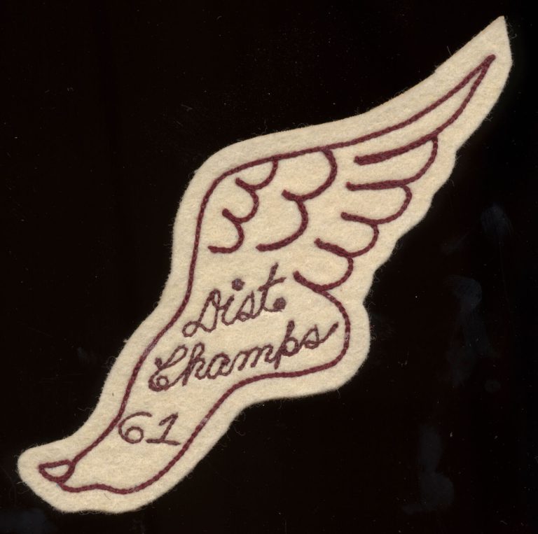 Winged-foot track patch embroidered Dist. Champs 61, from the James Ray Jackson collection