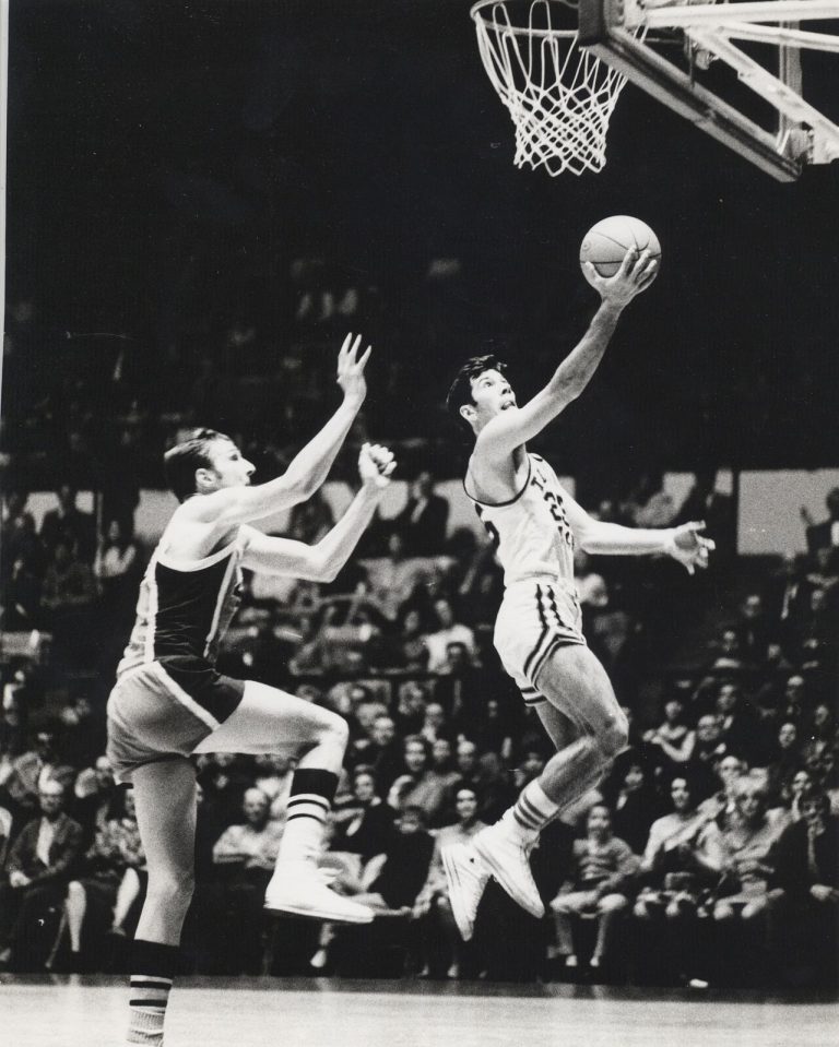Jerry Haggard going up for a layup in a Texas Tech basketball game, black and white