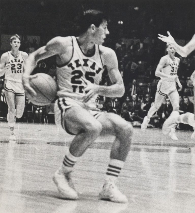 Jerry Haggard dribbling the ball for Texas Tech, black and white