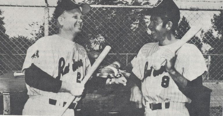 Jerry Haggard, right, talks with Texas Tech baseball coach Kal Segrist, from a newspaper clipping