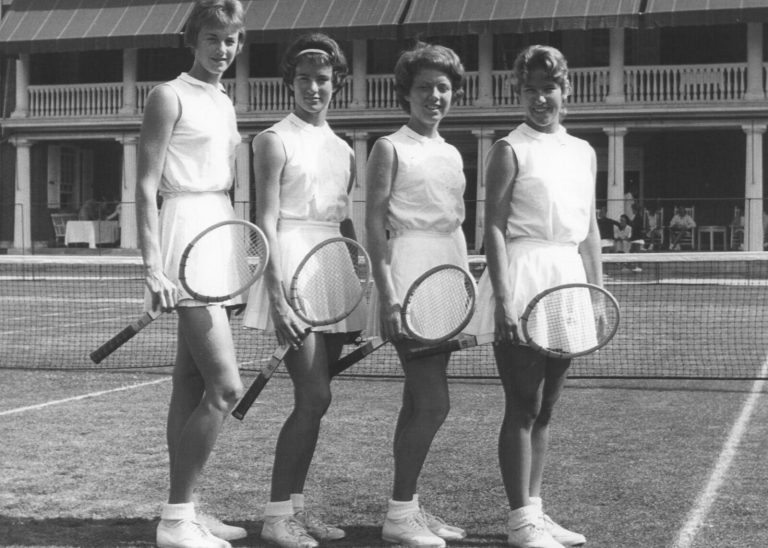 Jill Philbrick Gentry with three other tennis players holding rackets on a tennis court