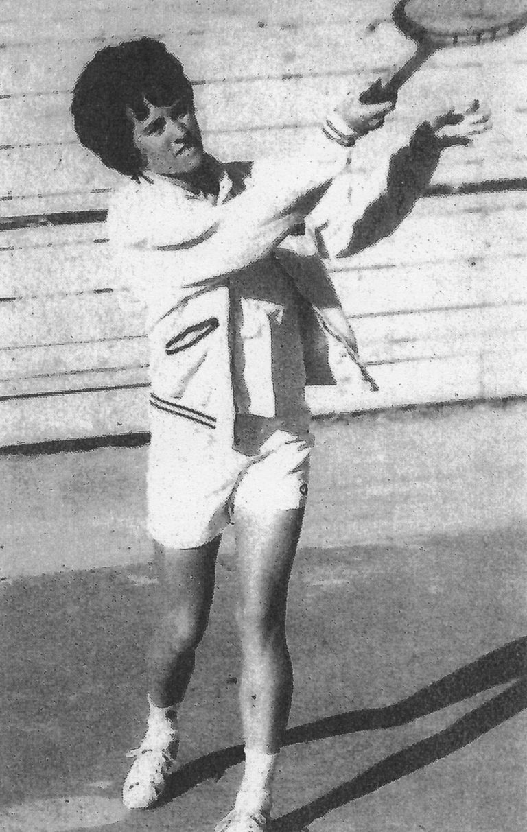 Jill Philbrick Gentry swinging overhead in a tennis stroke, from a newspaper clipping