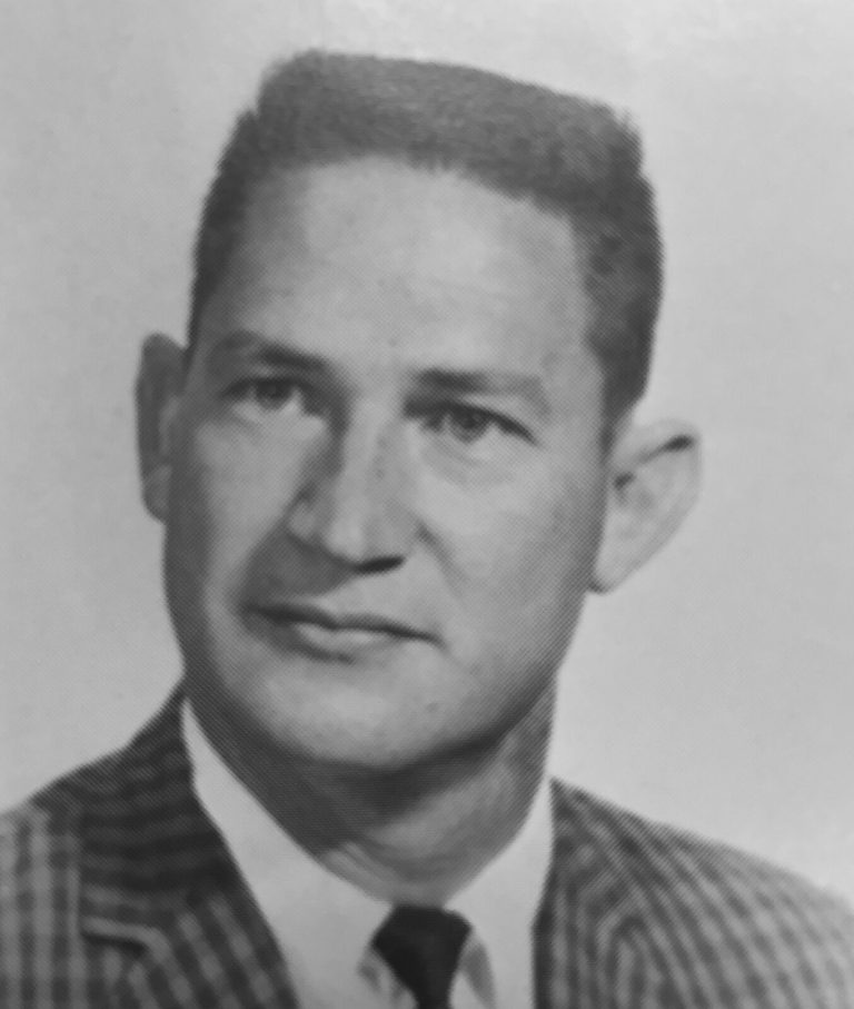 Jimmie Keeling in a checked sport coat and tie, younger black-and-white portrait