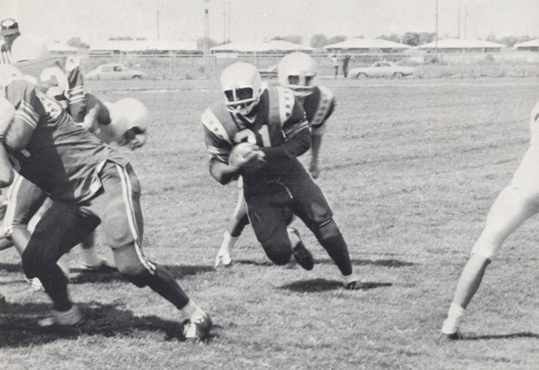 Estacado Matadors running play against Lubbock High, from a yearbook page naming Jimmie Keeling head coach
