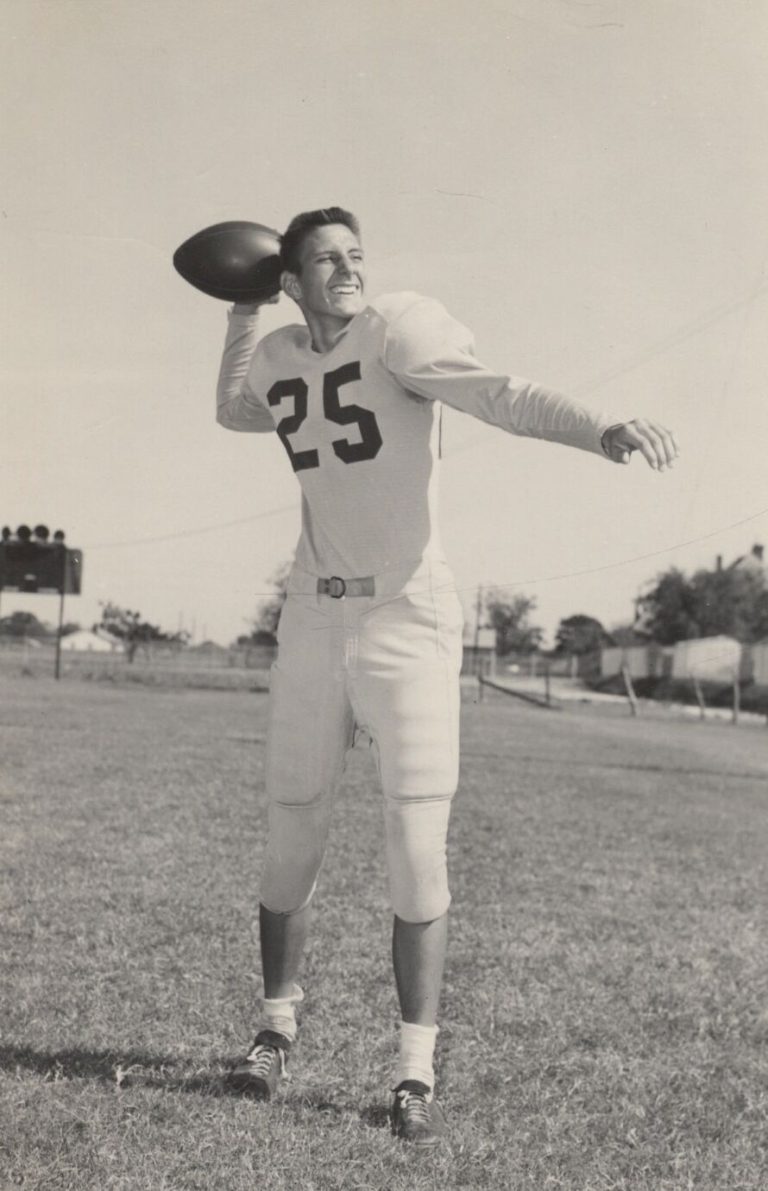 Joe Michalka in a number 25 football jersey, arm cocked to throw, in a vintage senior quarterback photo