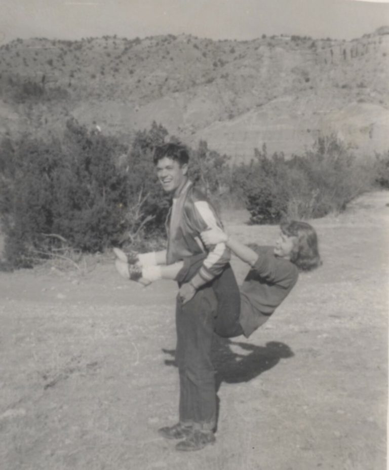 Young man laughing while giving a young woman a playful lift at Palo Duro Canyon, from the John Cardinal family photos