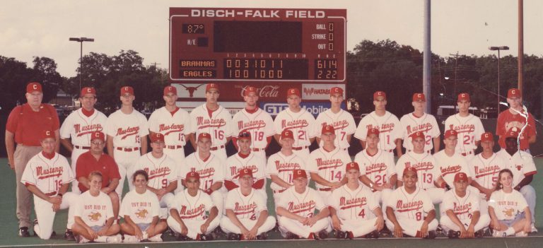 1995 Coronado baseball team posed in front of the Disch-Falk Field scoreboard, from the John Dudley collection