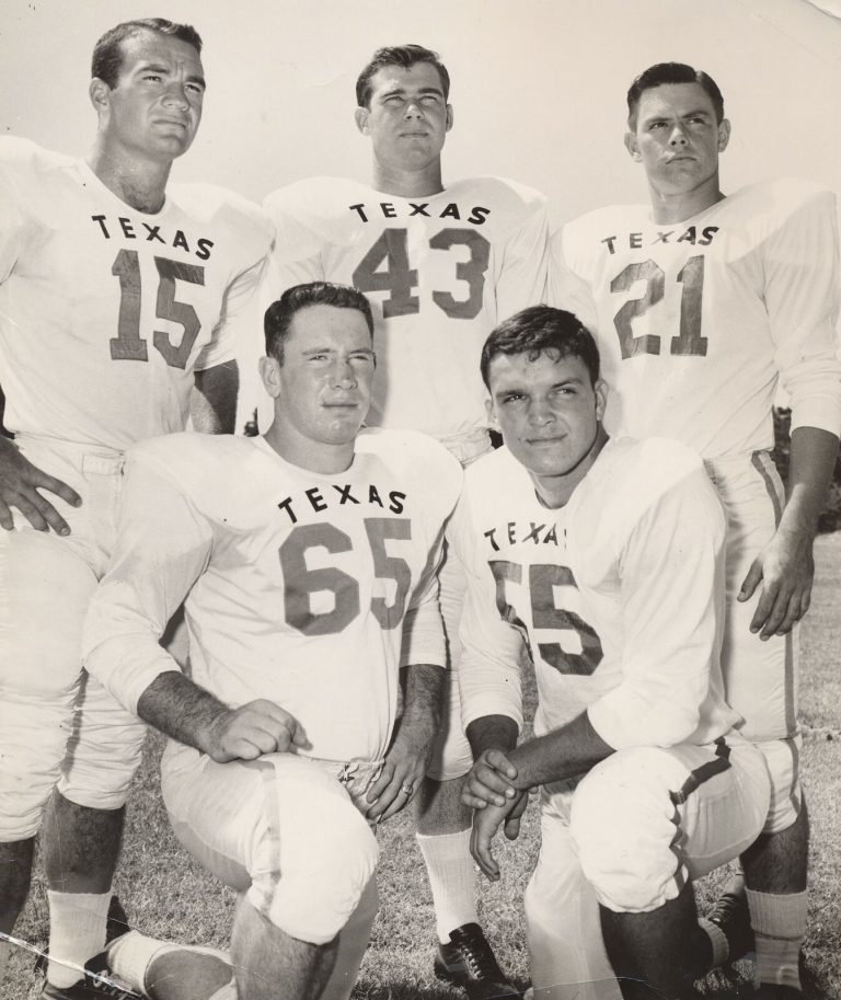 Johnny Tatum and four Texas teammates in white jerseys, two kneeling in front and three standing behind