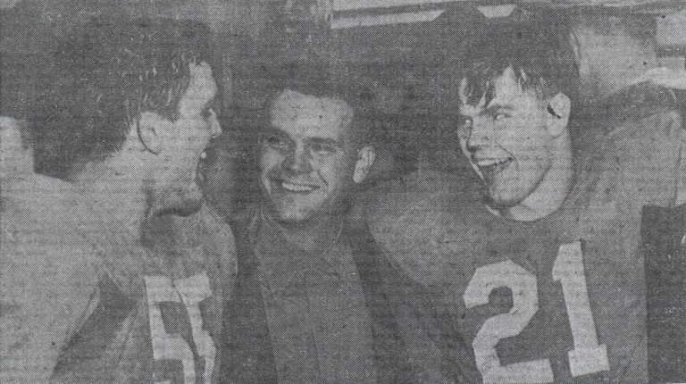 Johnny Tatum, at left, with brother Bill and quarterback Charley Brewer, number 21, in a newspaper photo