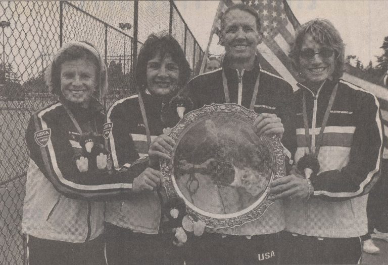 Kathy Kuhne Vick, third from left, with three USA teammates holding the Bueno Cup, from a newspaper