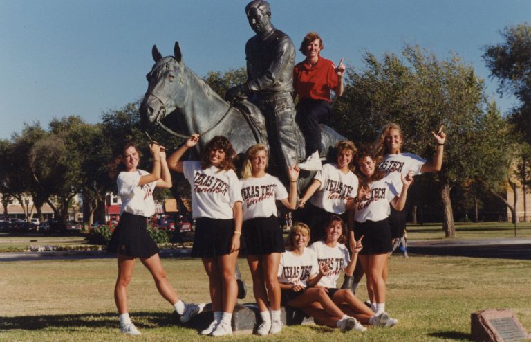 Kathy Kuhne Vick: Texas Tech women's tennis team posing at the Masked Rider statue
