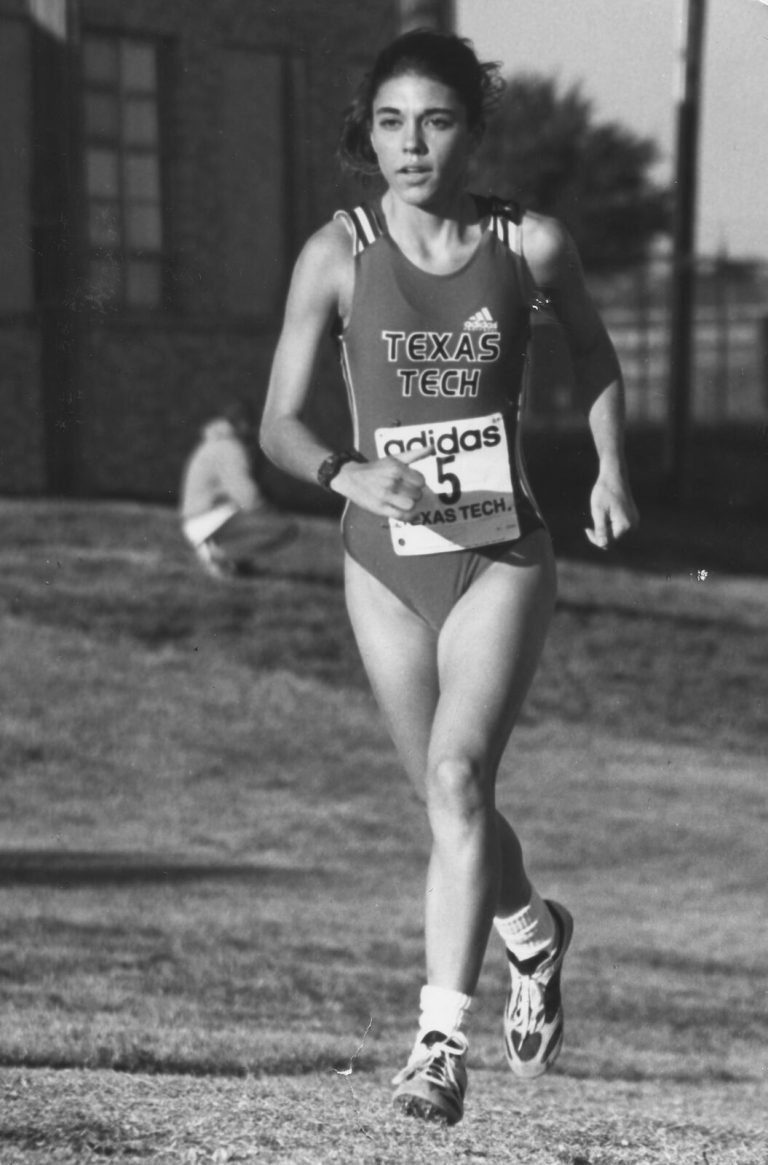 Leigh Daniel Cordes running toward the camera in a Texas Tech singlet, black-and-white