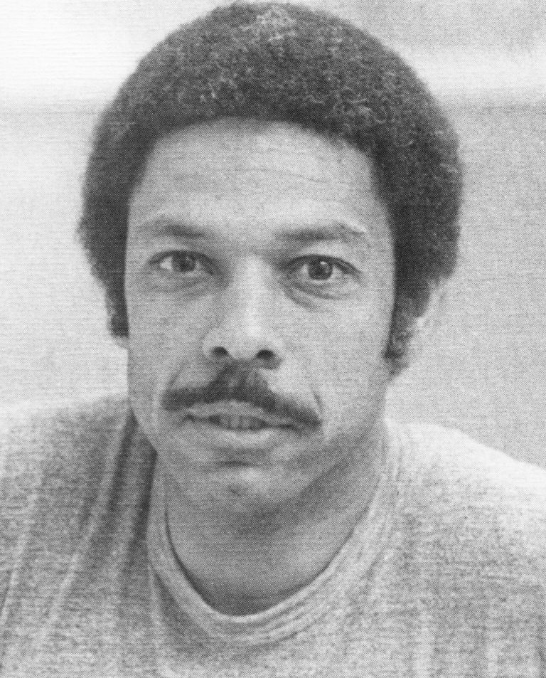 Melvin Houston with a mustache in a black-and-white 1980 portrait