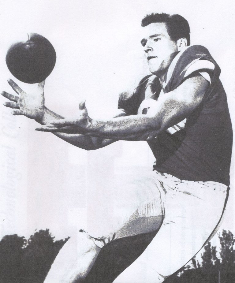 Pat Hartsfield reaching with both hands to catch a pass in a Texas Tech uniform, from 1957