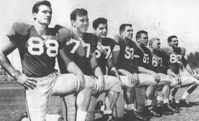 Pat Hartsfield, number 88, kneeling with Texas Tech teammates in a posed black-and-white starters photo
