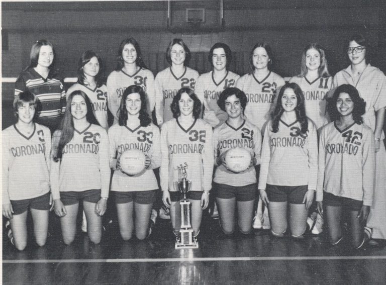 Patty Jones's 1977 Coronado volleyball team posed in rows with a trophy and volleyballs, black-and-white