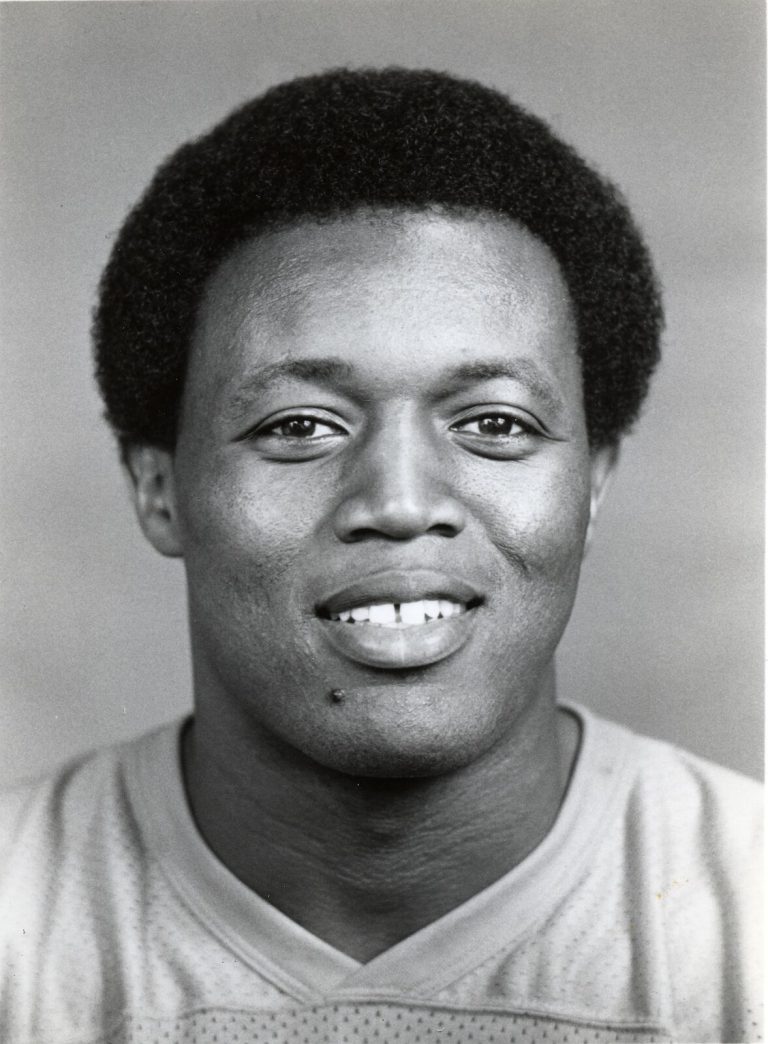 Thomas Howard smiling in a black-and-white headshot