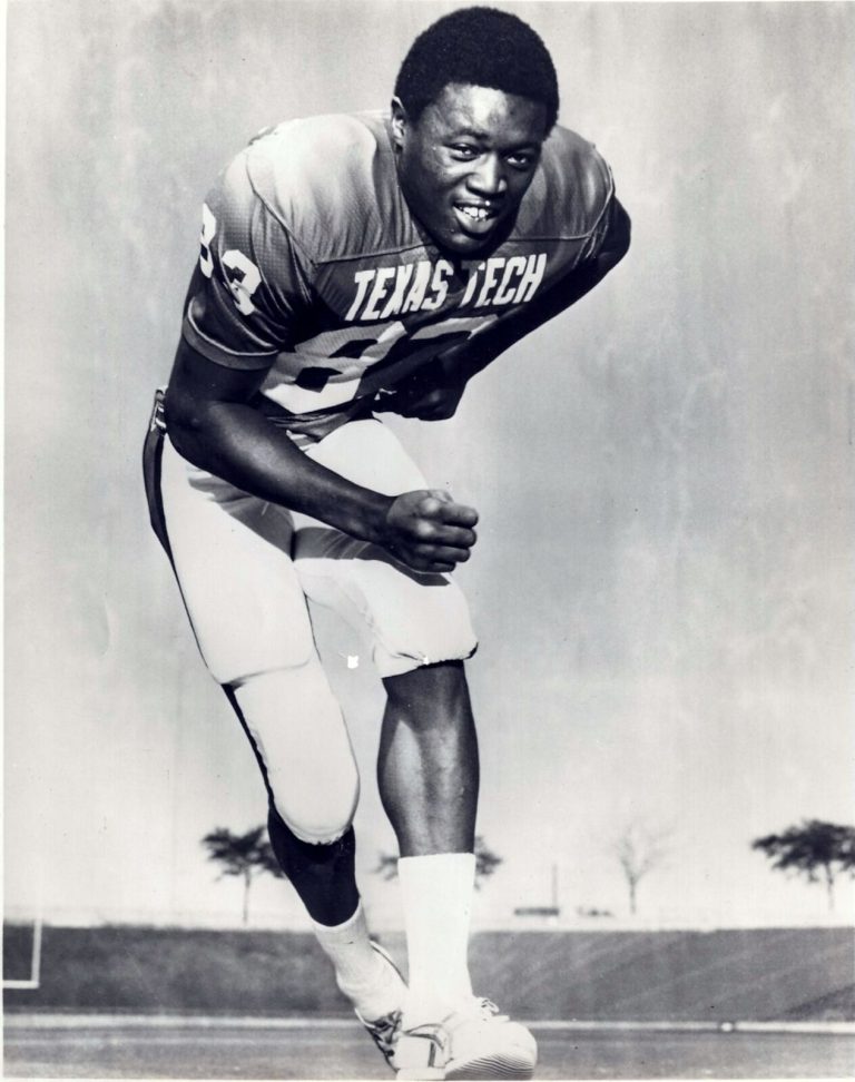 Thomas Howard in a Texas Tech jersey crouched forward in a black-and-white photo