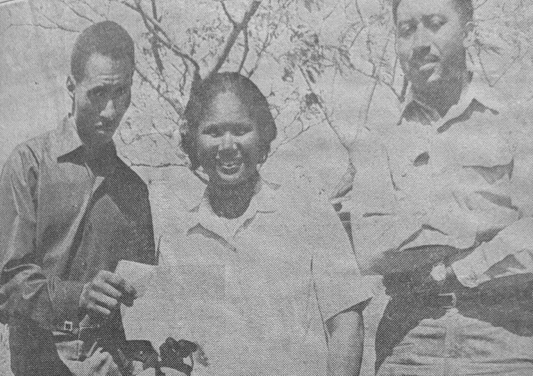 1970 State Champion Track Team sprinter Joe Benson with parents looking over a Sul Ross letter of intent, from a newspaper