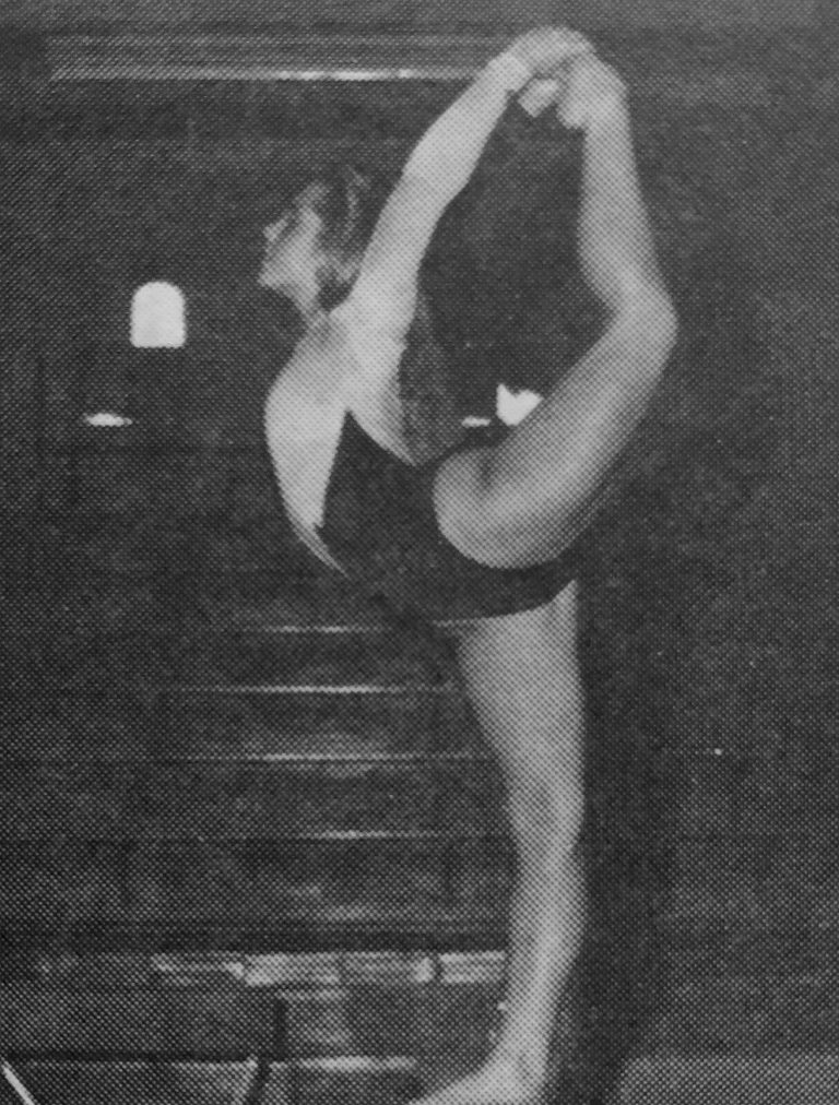 1989–90 and 1990–91 State Champion Gymnastics Teams: gymnast holding a leg overhead in a standing pose, black and white