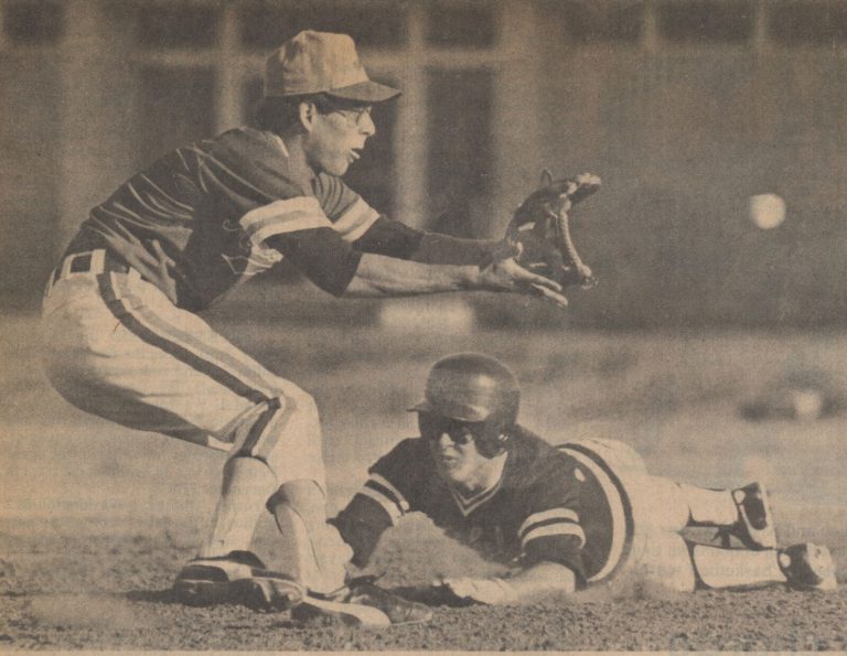 1981 State Champion Baseball Team shortstop Shawn McClain waits on the throw as Midland Lee's Barry Corley steals second base