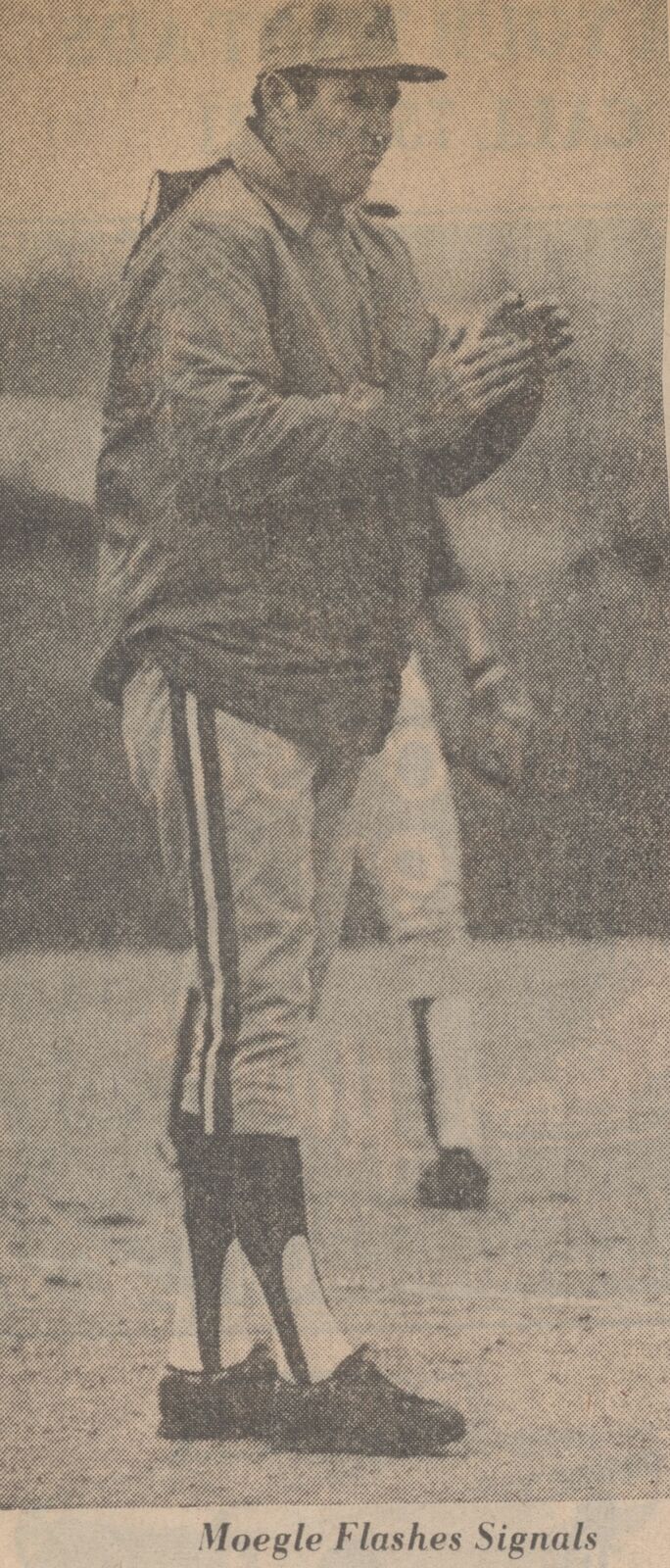 1981 State Champion Baseball Team coach Bobby Moegle flashing signals on the field, from a newspaper clipping