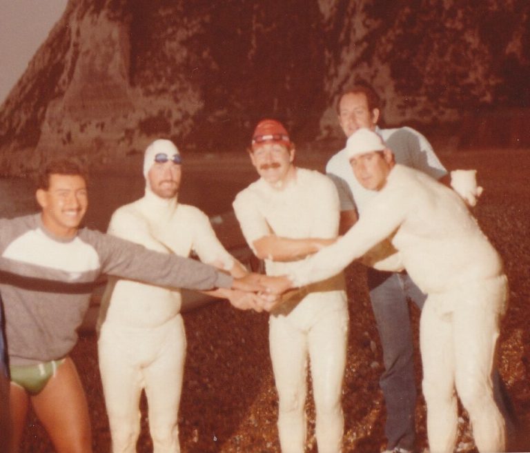 Relay swimmers coached by Ron Holihan joining hands before swimming the English Channel